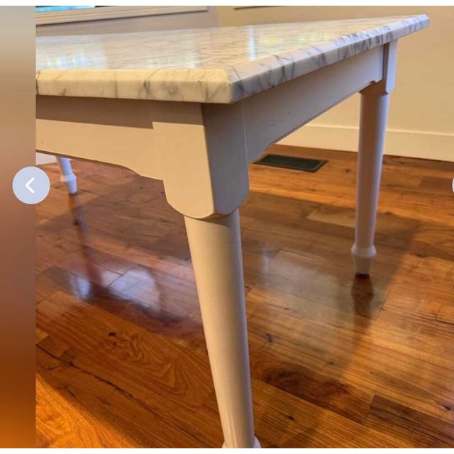 Gorgeous timeless Carrara Marble Table from Williams Sonoma. Feature a solid 1 3/8” thick marble slab with elegant natural...