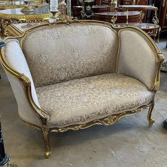 Loving the style. Beautiful sofa with antique white upholstery and gold details. Fully refinished in new gold and padding....