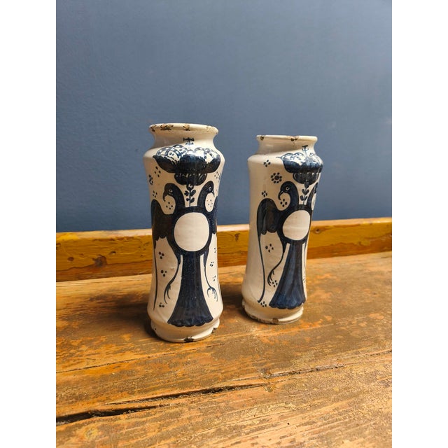 These two, presumably Italian Albarello, cobalt blue apothecary jars depicting a double-headed eagle on a white background...