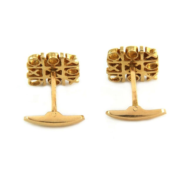 This is a unique style men's cufflinks, it is crafted from 14k yellow gold featuring an old famous game tic tac toe with...