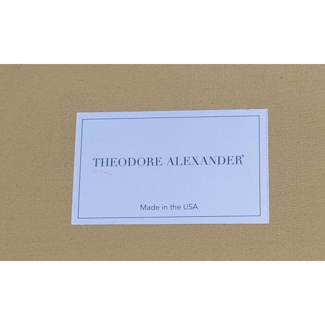 A super fine Theodore Alexander long rolled arm and tufted sofa. Featuring a fringe skirt over top a pleated skirt tufted...