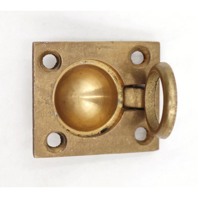 Reclaimed recessed rectangular drawer or cabinet flush ring pull made of brass with a polished finish. The original...