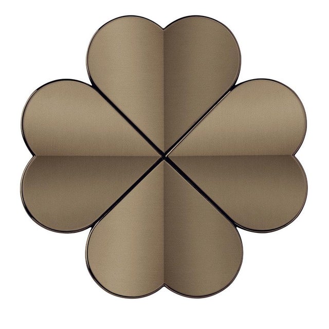 The Lucky coat stand by Richard Hutten features a refined and elegant design resembling a four-leaf clover, symbolizing...