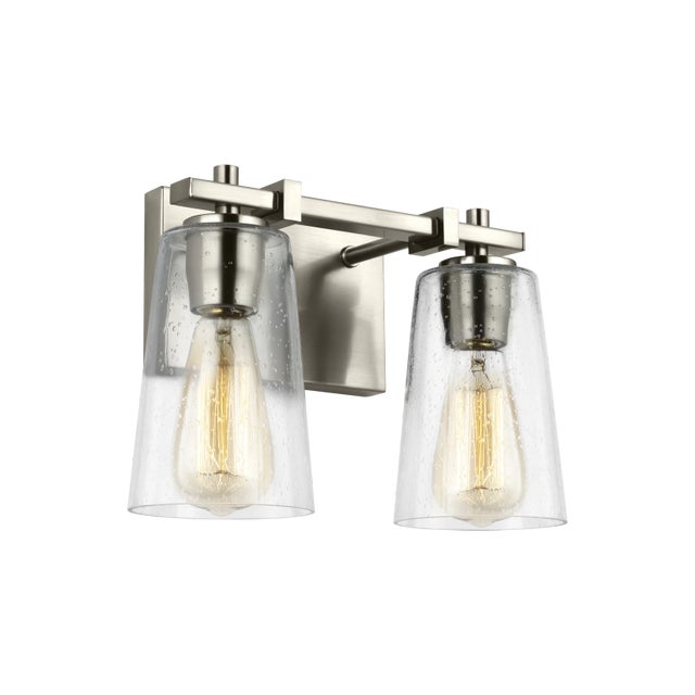 The Sean Lavin Mercer two light vanity fixture in satin nickel provides abundant light for your bath vanity, while adding...