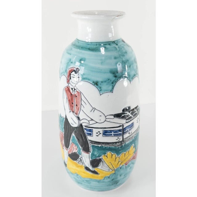We are selling this bright and colorful art pottery vase. This mid-century vase is signed on the base Br. V. Ostfold...
