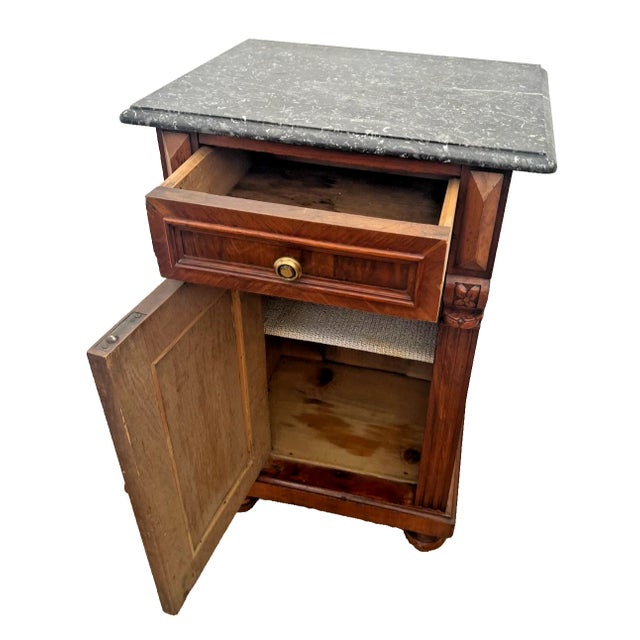 Stunning 19th-century European bedside cabinet, masterfully crafted in the grand tradition of the Empire and Biedermeier...