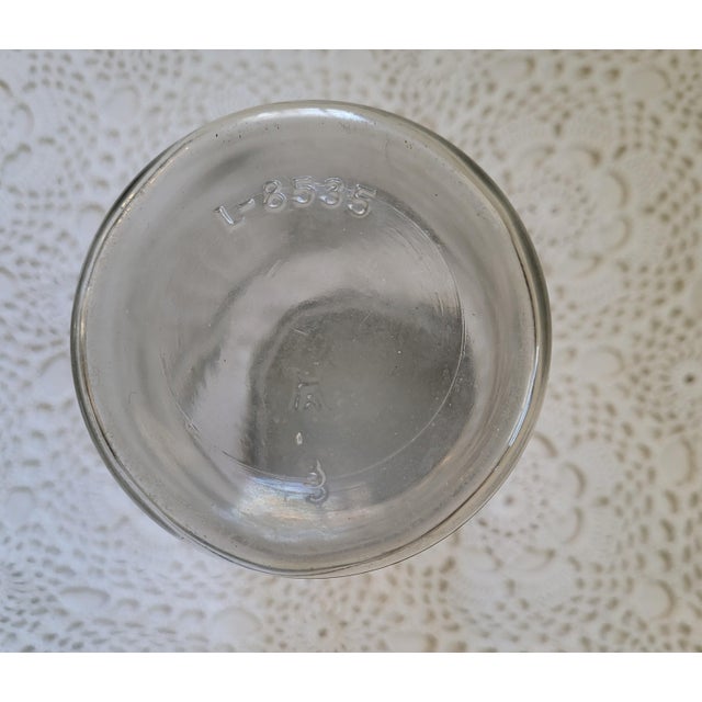 A Hazel Atlas quart jar and zinc lid measuring 7 1/2” x 3 ½” diameter. Likely from the 1930s/1940s. This would look lovely...