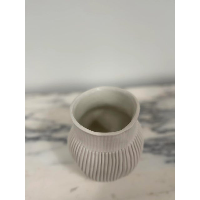 A true statement to the artist’s ingenuity, this exquisite creation marries delicate porcelain craftsmanship with a unique...