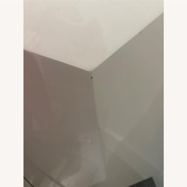 Beautiful lacquer credenza, featuring a white finish and gold hardware. I have owned this credenza for about five years...