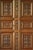 A stunning piece, featuring intricate hand-carved patterns on its front panels in the style of Victorian English oak...