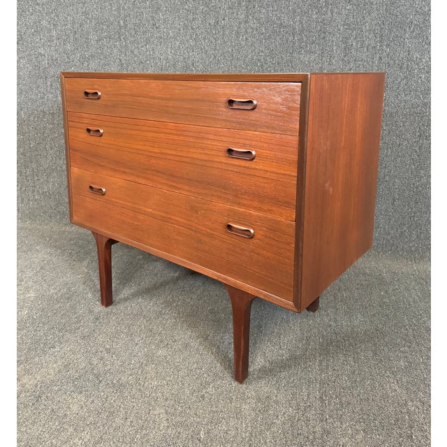 Here is a beautiful scandinavian modern dresser in teak manufactured in Denmark in the 1960's and attributed to Arne...