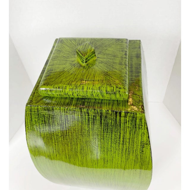 With its square base, this freestanding jar is designed with seagrass green patterns. Set of Jars.