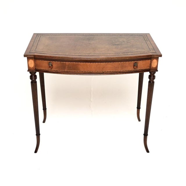 A beautiful and elegant antique inlaid leather top writing / side table. This was made in England, it dates from around...