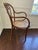 Pair of antique bentwood armchairs with woven cane seats. They’re comfortable and great at the ends of a dining table, as...