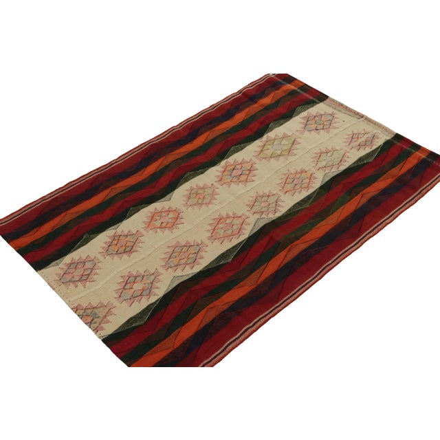 An extremely collectible vintage Persian Kilim of Qashqai provenance, handwoven in wool circa 1950-1960. This tribal rug...