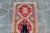 An eye-catching vintage runner features a stunning row of medallions as the central point. This runner includes a color...