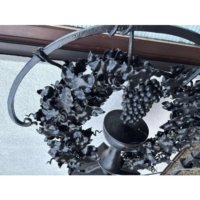 Exceptional large-scale cast-iron wall lantern / architectural ironwork with a highly decorative presence. The robust...