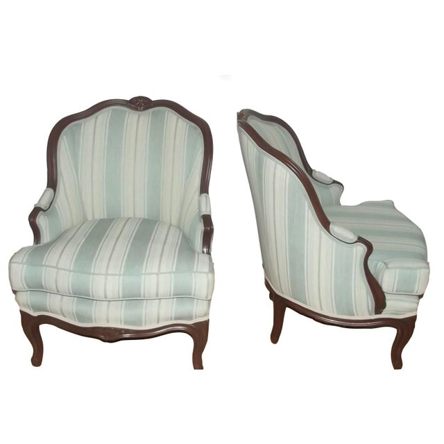 Charming pair of Late 19th or Early 20th Century Louis XV Bergeres. This set has great detail and design. They feature...