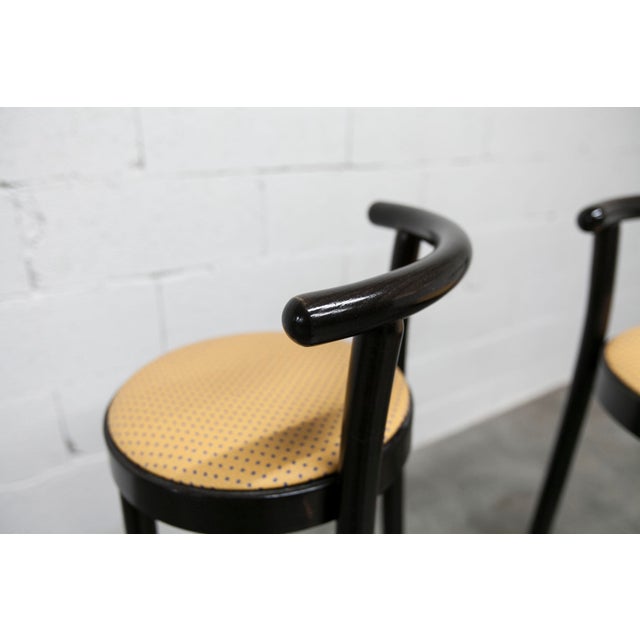 Pair of Baumann Dialog stools in black with quilted vinyl seats. Seat height 80 cm. These stools are from the 1990s, but...