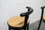 Pair of Baumann Dialog stools in black with quilted vinyl seats. Seat height 80 cm. These stools are from the 1990s, but...