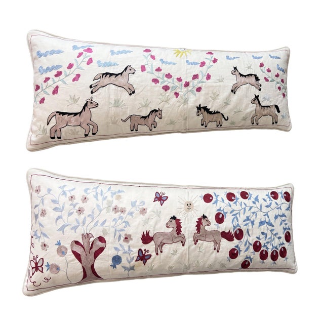 This beautiful 18'' x 54'' hand-embroidered Suzani pillow cover set was made from authentic Uzbek cotton fabric. The...