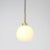 This simple modern pendant lamp is made of brushed brass with a matt glass globe. It looks best when hanging in pairs or...