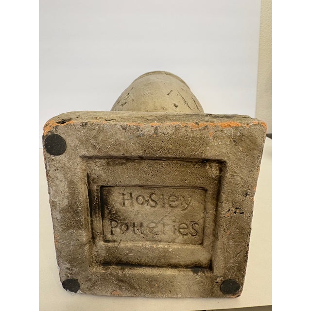 This outdoor textured accent garden vase/planter is stamped on the bottom with "Hosley Potteries" and was made during the...