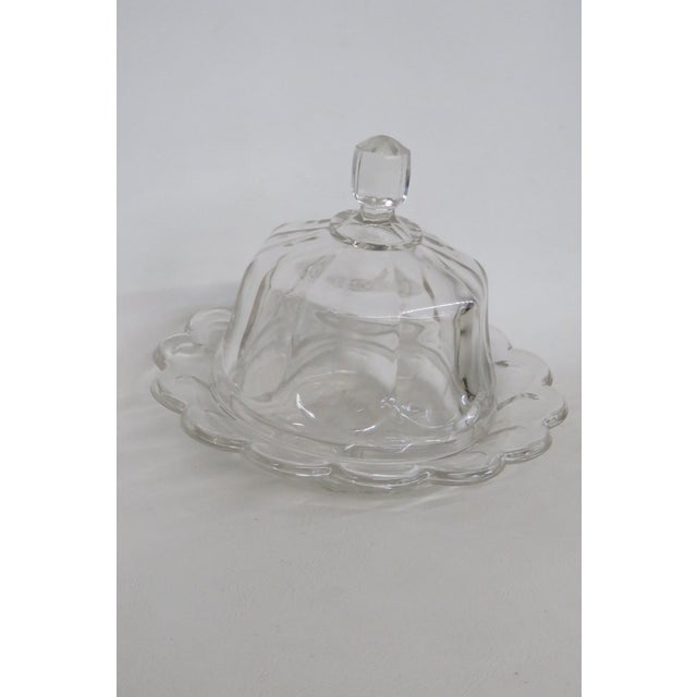 This stunning Butter / Cheese serving dish is made of pressed glass. This dish features a clear pressed crystal design...