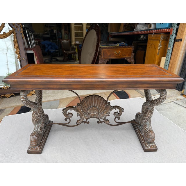 This striking console table features an intricately sculpted koi fish motif, with a pair gracefully facing forward, a...