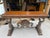 This striking console table features an intricately sculpted koi fish motif, with a pair gracefully facing forward, a...