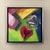 Hearts & Ribbons features an interplay of vibrant colors and textured forms, with bold strokes creating a dynamic...
