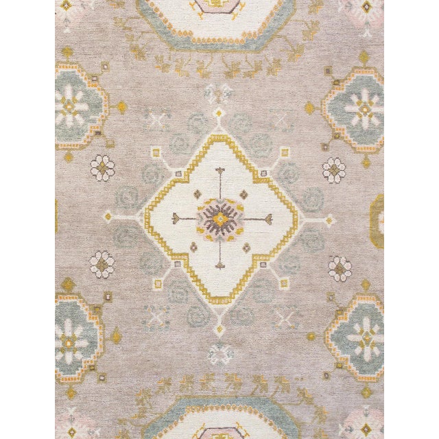 Khotan hand-knotted rugs are quite unique folk artifacts which display elements of rich, historical cultures. These rugs...