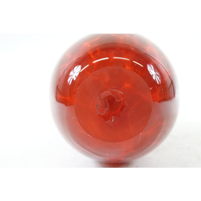 Decorative Art Glass Vase – 10ʺ × 4.5ʺ × 14ʺ Add a bold, artistic flair to your space with this striking decorative art...