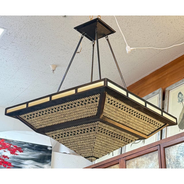 Design Plus Gallery presents a Pyramid Shaped Chandelier from Hilliard Art. The chandelier is made of a bronze metal frame...