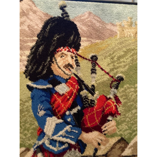 A very unique Scottish bagpiper embroidered on a frame. Hand knitted needlepoint. If you pass on this retro piece, than...