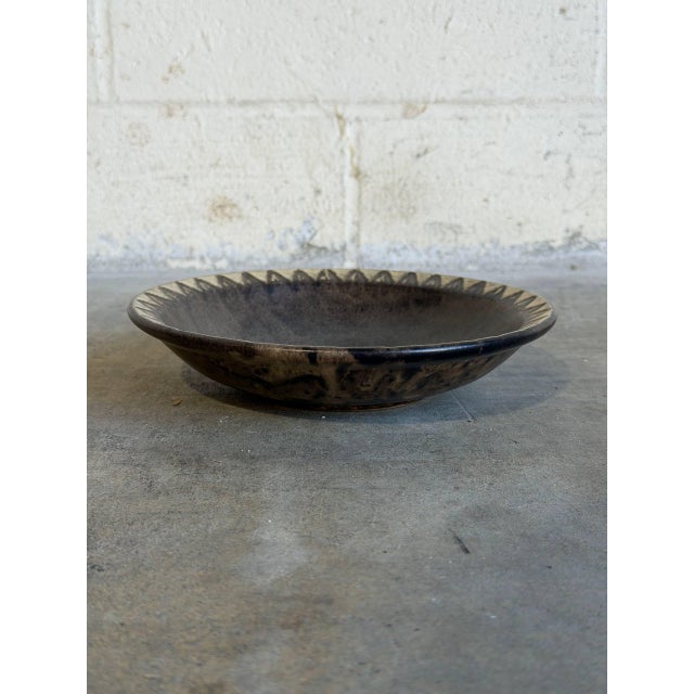 This vintage ceramic plate bowl features an elegant shallow design that seamlessly blends rustic texture with refined mid-...