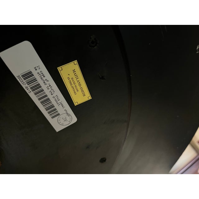 Extraordinary round center table or side table by Maitland-Smith. The top is beautifully inlaid with mother-of-pearl that...