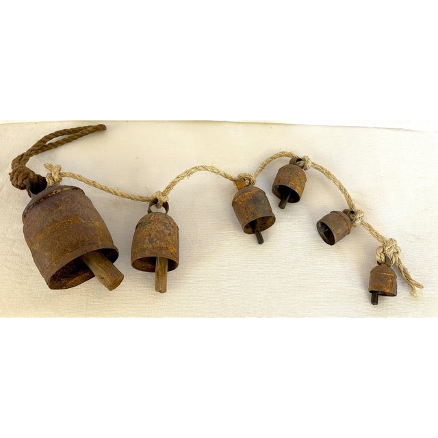 Farmhouse Antique Six Primitive Cow Bells With Wood Clappers on a Rope For Sale - Image 3 of 12