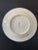 Beautiful little white porcelain plate decorated with different flowers such as petunias and phlox. The leaves seem to...