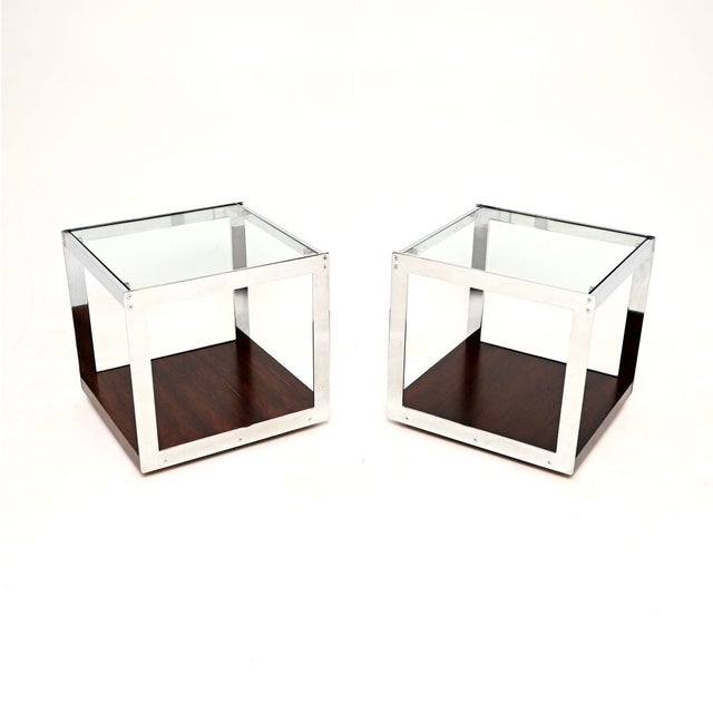 A superb pair of vintage glass and chrome side tables by Merrow Associates. They were designed by Richard Young and made...