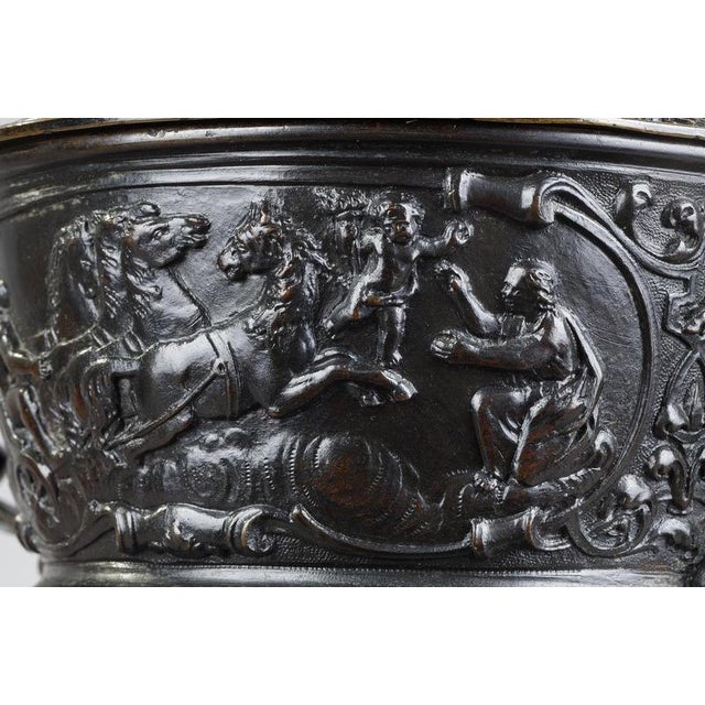 Pedestal bowl in the form of a triton emerging between two water horses and blowing into a conch with its lid surmounted...
