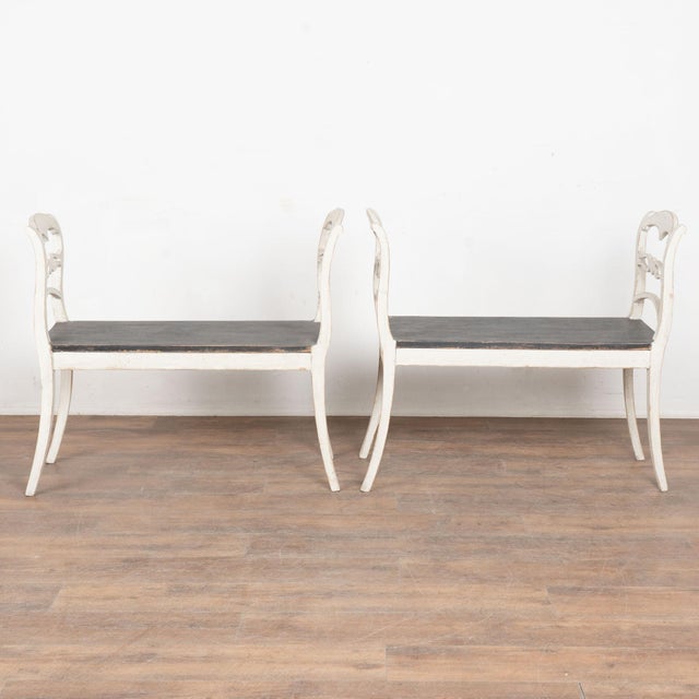 Late 19th century pair of Swedish Gustavian benches, crafted in pine. Unusual to find as a pair in this size, these...