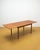 Vintage 1960s Danish teak table with two butterfly extension leaves, an elegant design with rounded corners, perfect for...