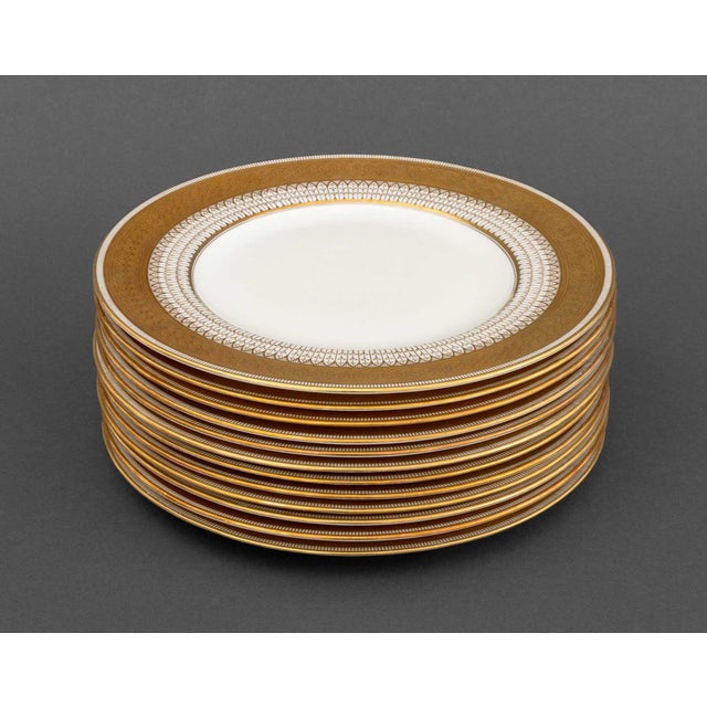 Set of 12 Cauldon Co. for Tiffany & Co. Porcelain Dinner Plates, with gilt scrollwork and foliate trim, marked "Cauldon...