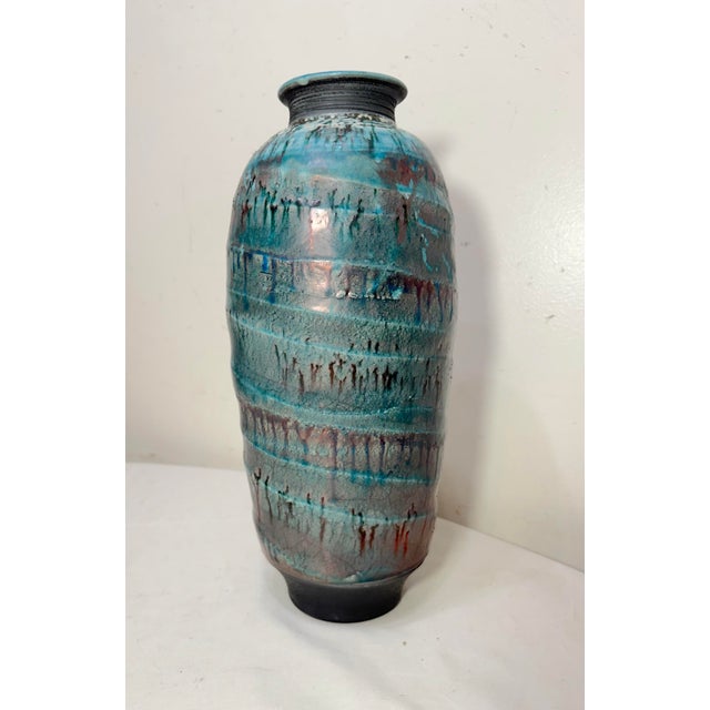 Up for sale is a tall vintage signed original Tom Neugebauer Raku glazed pottery vase, crafted in the late 20th century....