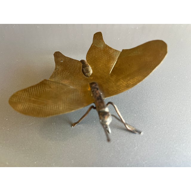 I seem to like insects tchotchkes hidden around my books, vases, vignettes. Picked up this little fellow in Paris....