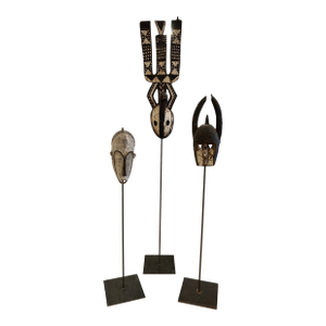Collection of African Carved Wood Masks on Tall Custom Iron Stands