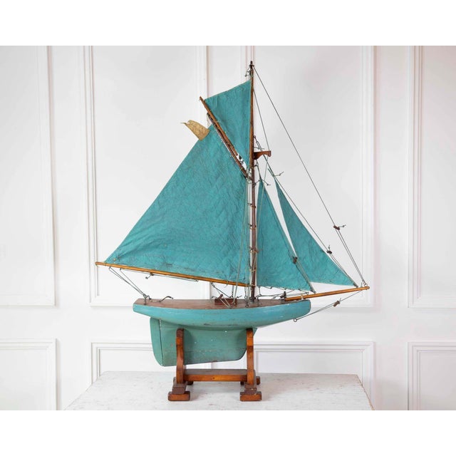 Carved in wood and named 'Kangaroo,' this English pond yacht dates to the twentieth century and is rigged as a gaff...
