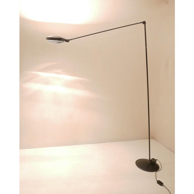 "Elle 55" model floor lamp by Tommaso Cimini for Lumina, Italy, 1980s Black steel structure, halogen lamp with shade....