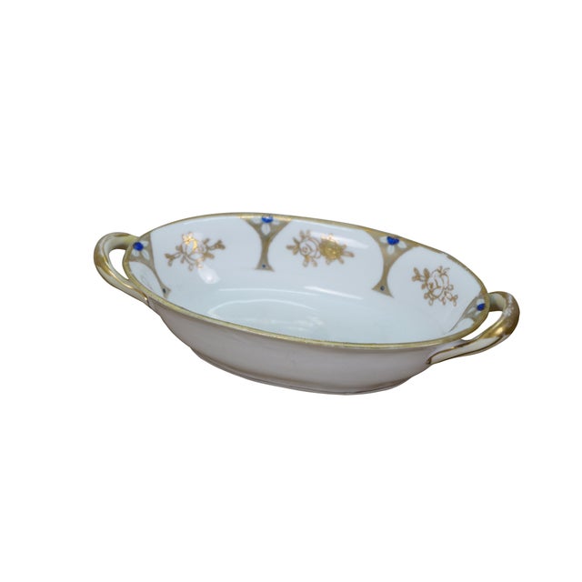 Early 20th century Noritake porcelain serving dish - over shape with two handles, decorated with a gold and cobalt blue...